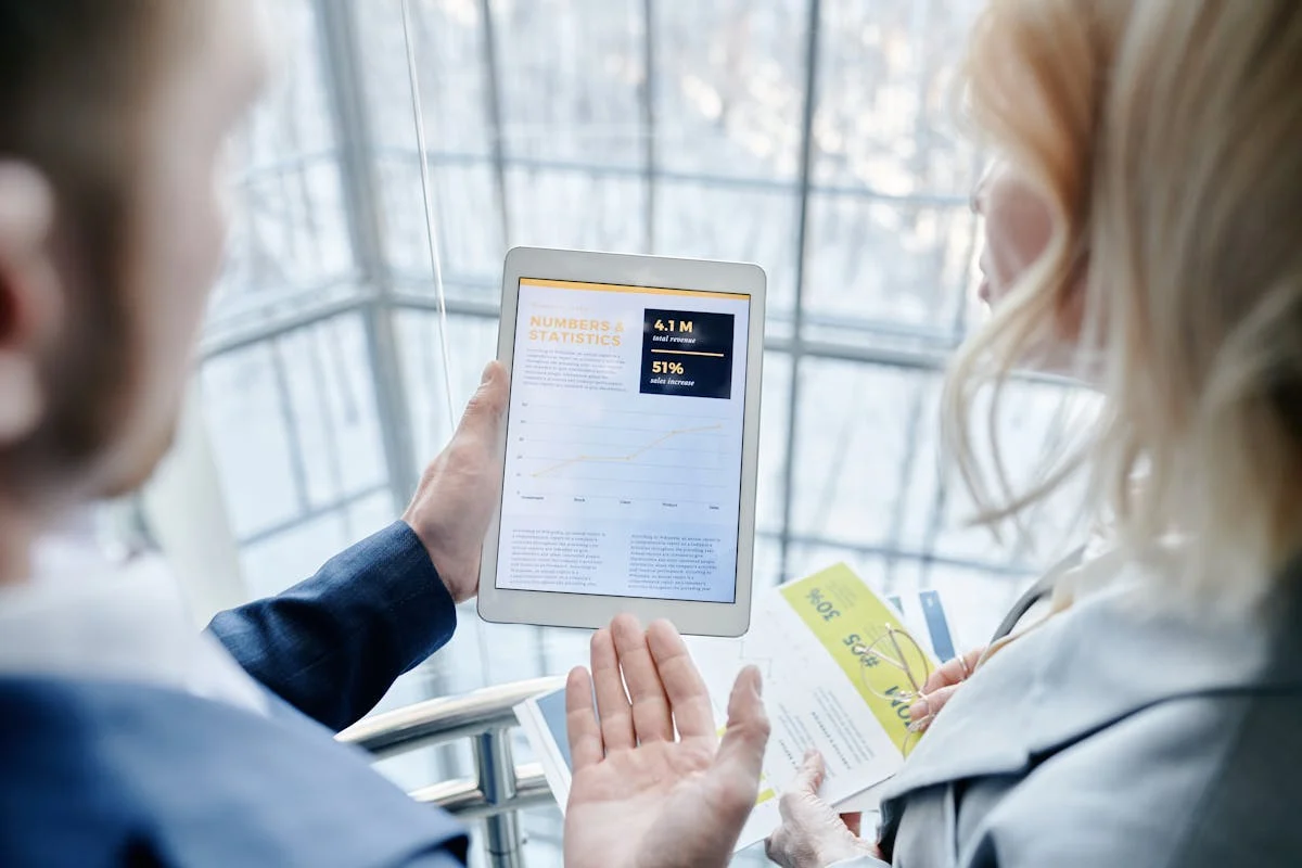 Business professional reviewing detailed service categories and business profile information on tablet