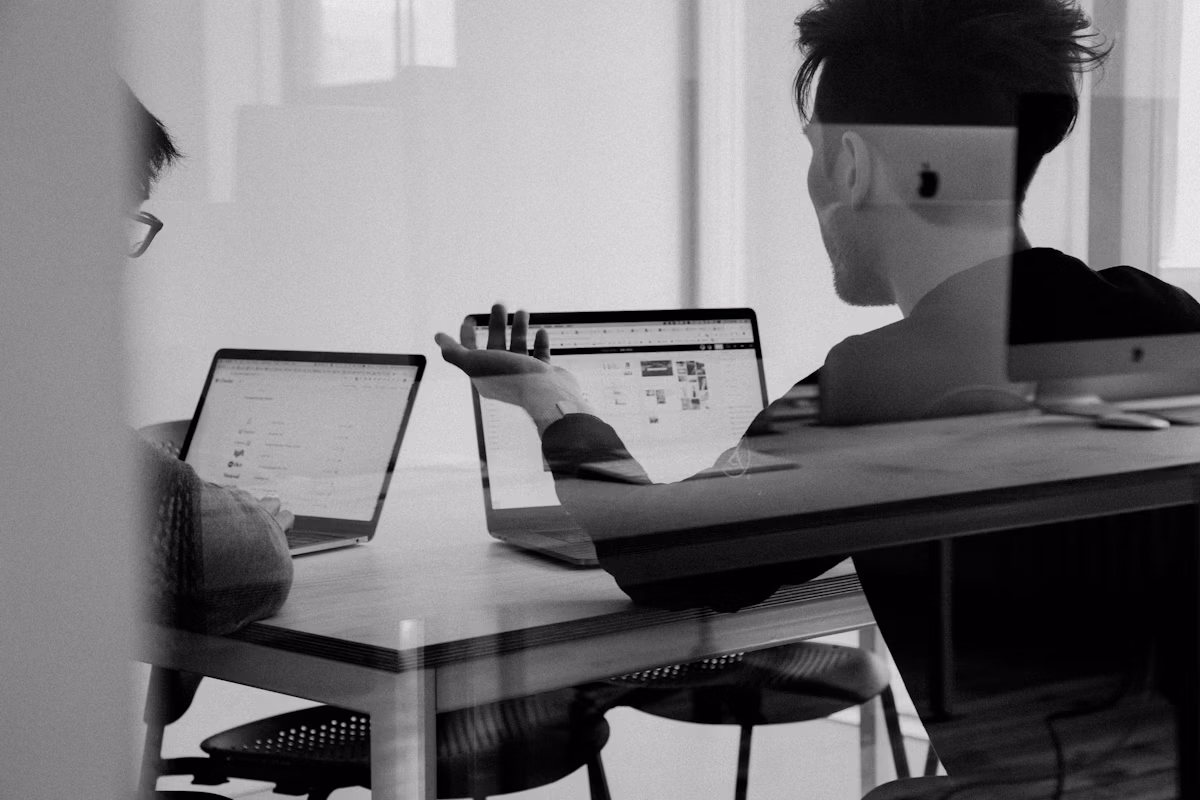 Small business owner reviewing SEO analytics on a laptop at a desk